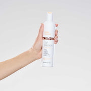 milk-shake-curl-passion-conditioner-in-hand